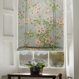 Blind in a printed linen fabric with floral pattern in blue, green and white colours.