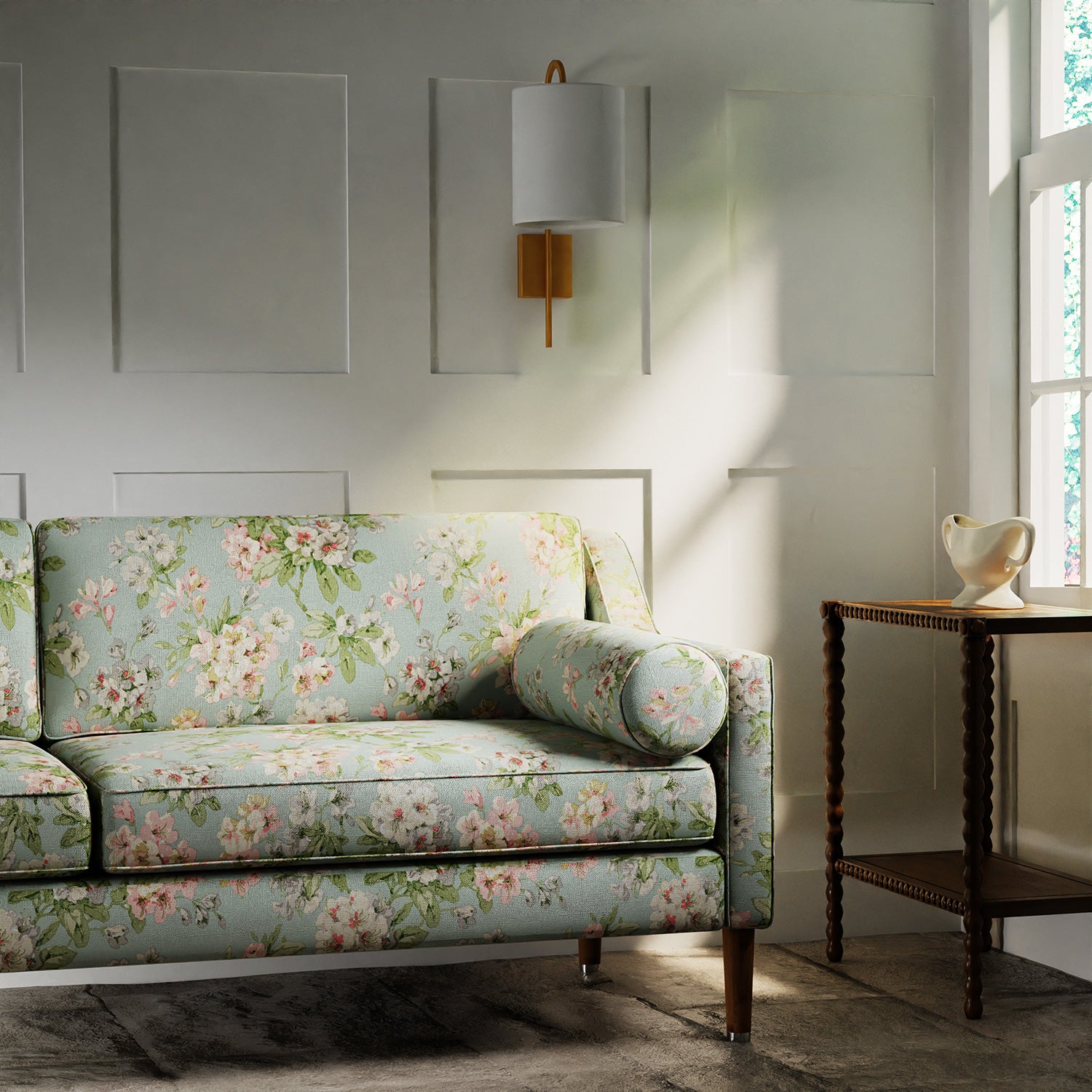 Sofa in a printed linen fabric with floral pattern. in blue, green and white colours.