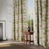 Curtains in a printed linen fabric with floral pattern in green, pink and white.