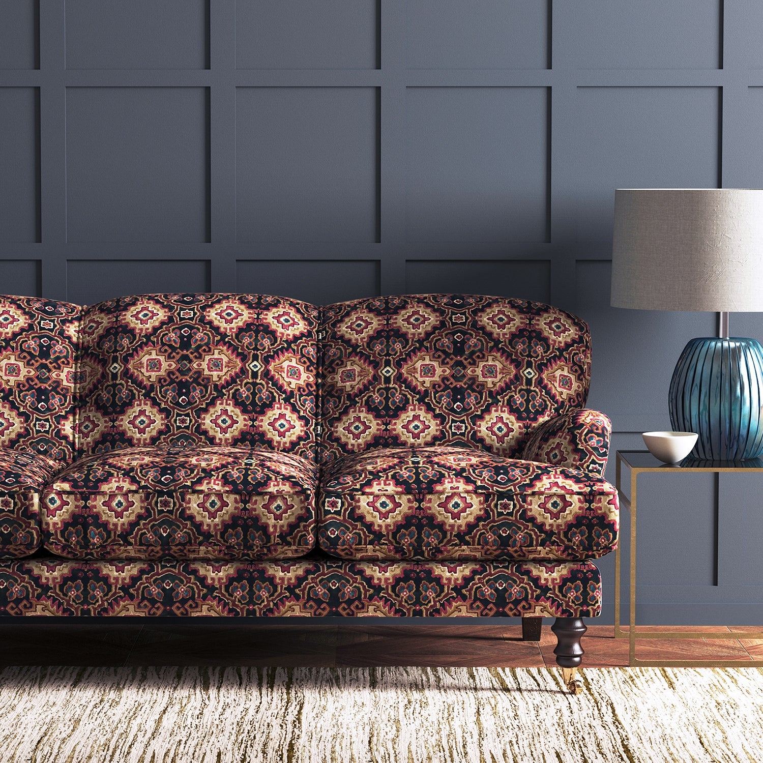 Velvet sofa upholstered in a printed velvet fabric with an oriental geometric design in multicolours