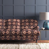 Velvet sofa upholstered in a printed velvet fabric with an oriental geometric design in multicolours