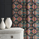 Velvet curtain in a printed velvet fabric with an oriental geometric design in vibrant colours
