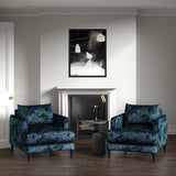 Velvet armchairs upholstered in a printed velvet fabric with enchanting landscape of abstract clouds design in blue and green colours.