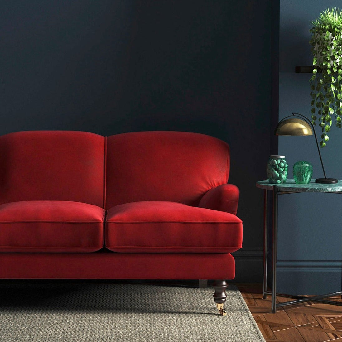 Sofa covered in a red velvet upholstery fabric
