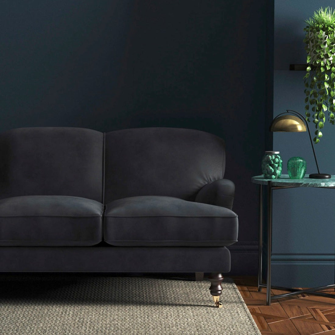 Sofa covered in a grey velvet upholstery fabric