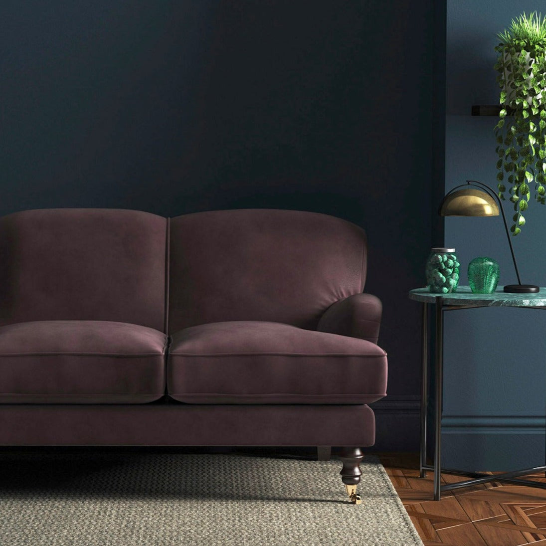 Sofa covered in a purple velvet upholstery fabric