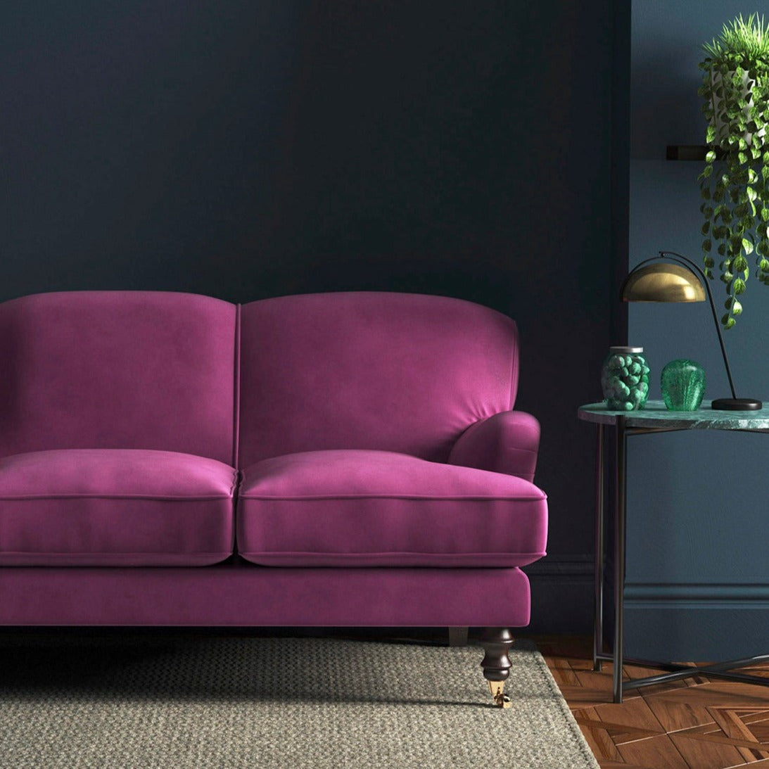 Sofa covered in a pink velvet upholstery fabric