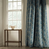 Curtains in a classic blue floral and leaf fabric