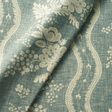 Fabric swatch of a blue floral fabric with striped design for curtains and upholstery