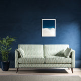 Sofa upholstered in a light blue herringbone upholstery fabric