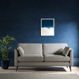 Sofa upholstered in a dark blue and neutral herringbone upholstery fabric