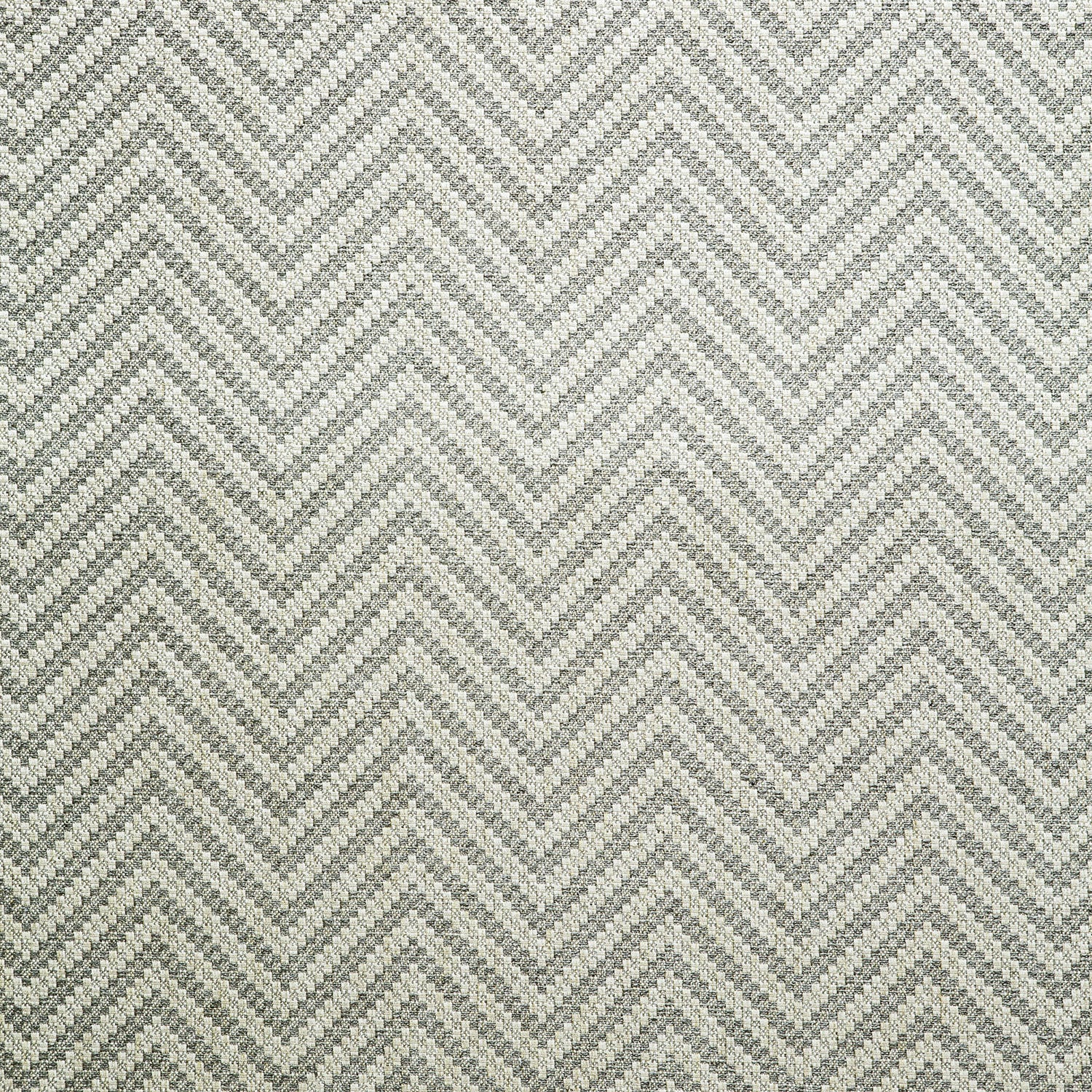 Fabric swatch of a grey herringbone weave fabric for curtains and upholstery