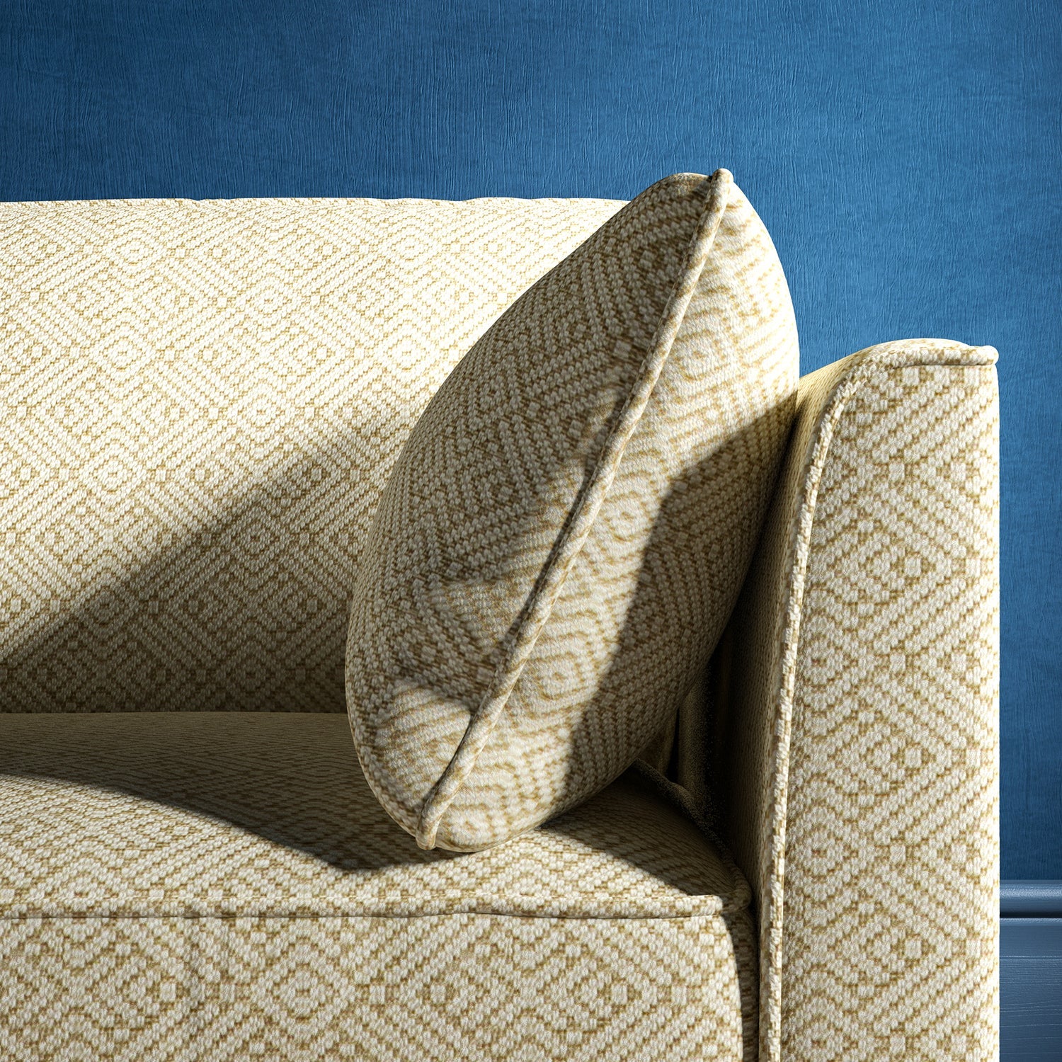 Sofa upholstered in a neutral geometric weave upholstery fabric