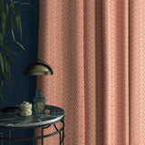 Curtains in a pink and white geometric weave fabric