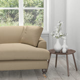 Sofa in a neutral fabric with a light neutral geometric woven design