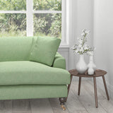 Sofa in a aqua fabric with a woven, light geometric design
