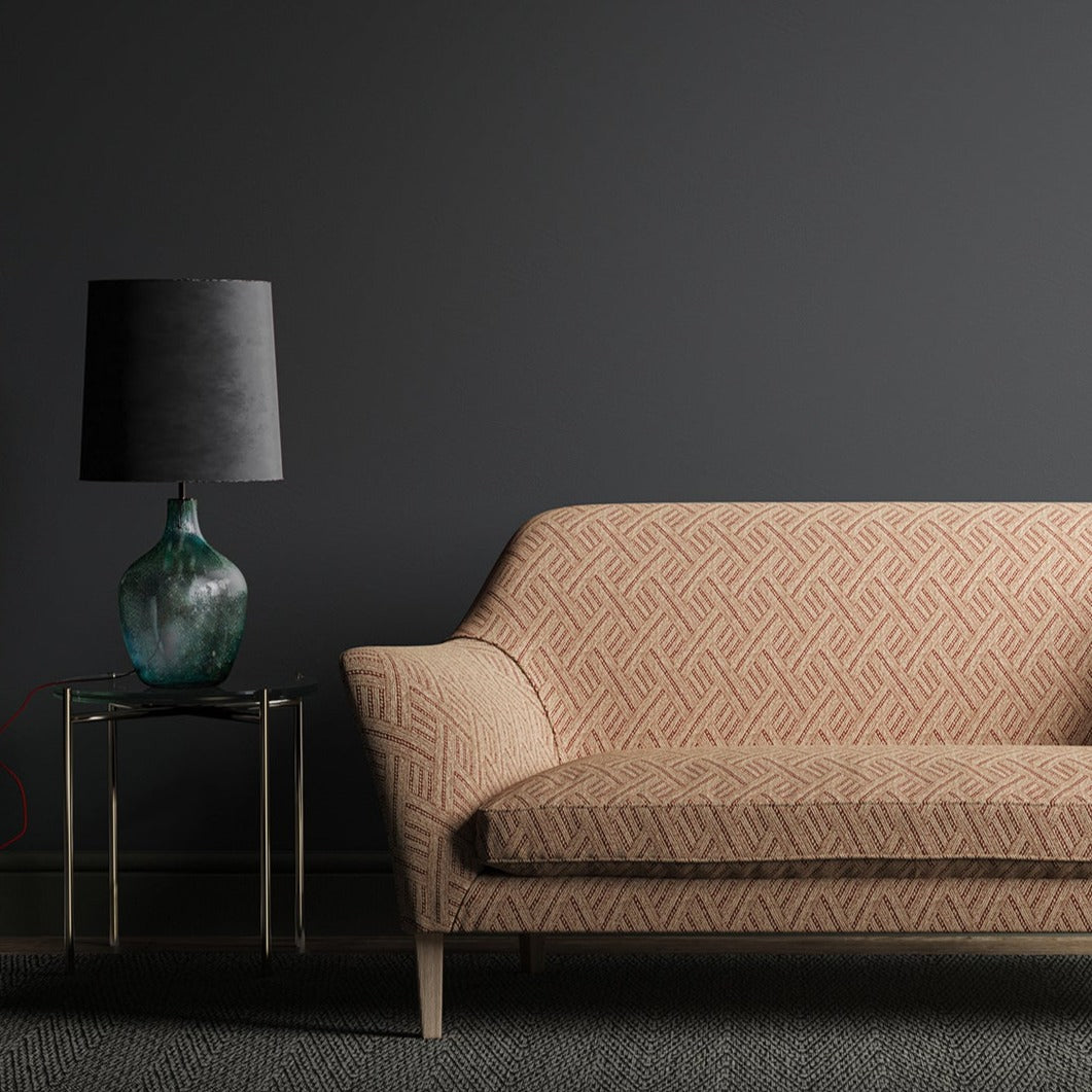 Sofa in a red and neutral geometric weave fabric