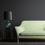 Sofa upholstered in a small scale green, pink and cream geometric weave