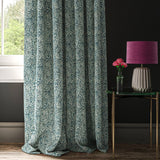 Dark blue curtain wiht a small white tropical print