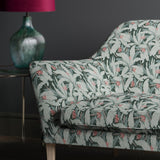 Sofa in a printed blue fabric with tropical leaf design
