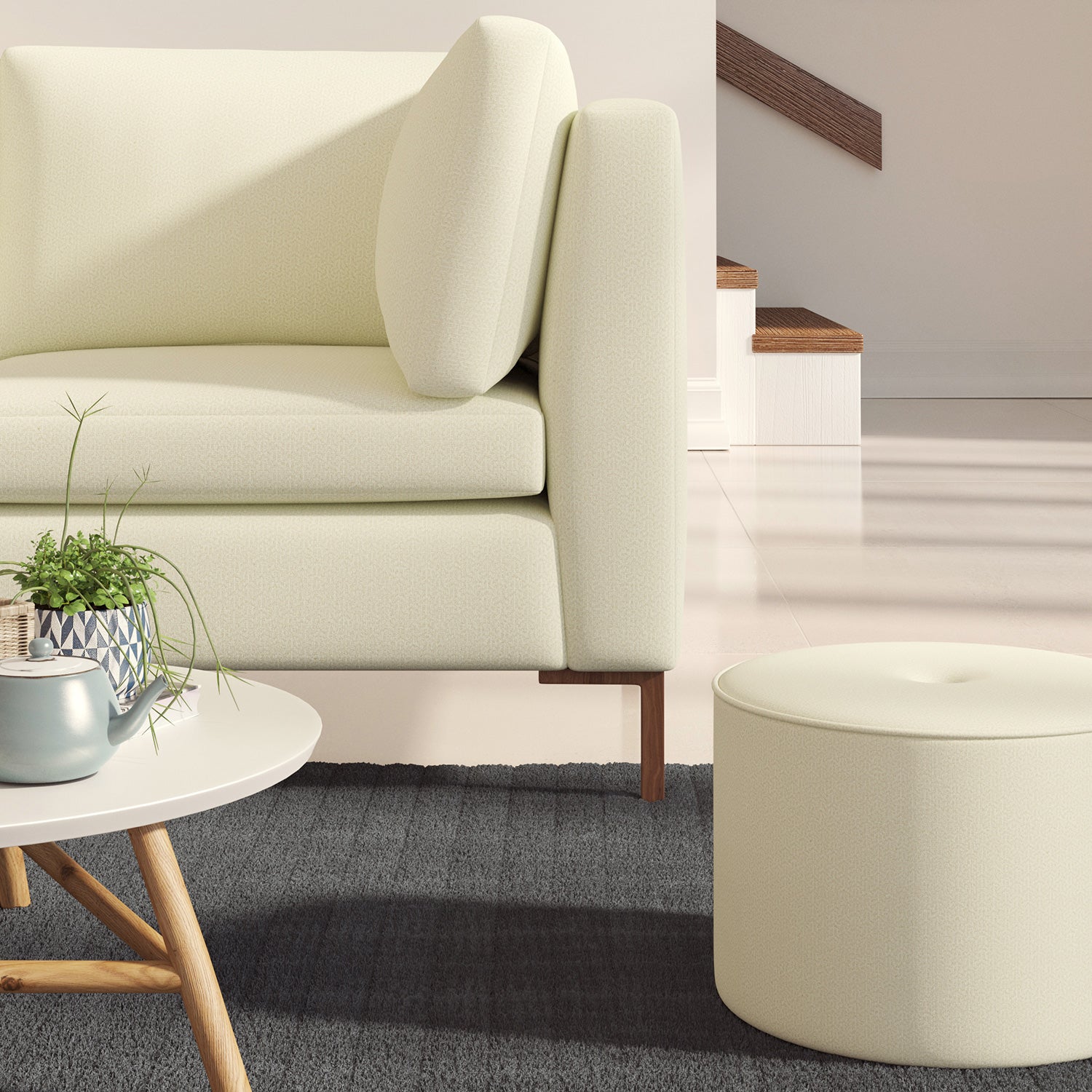 Living room with a contemporary sofa upholstered in a cream semi-plain Scandi-style upholstery fabric