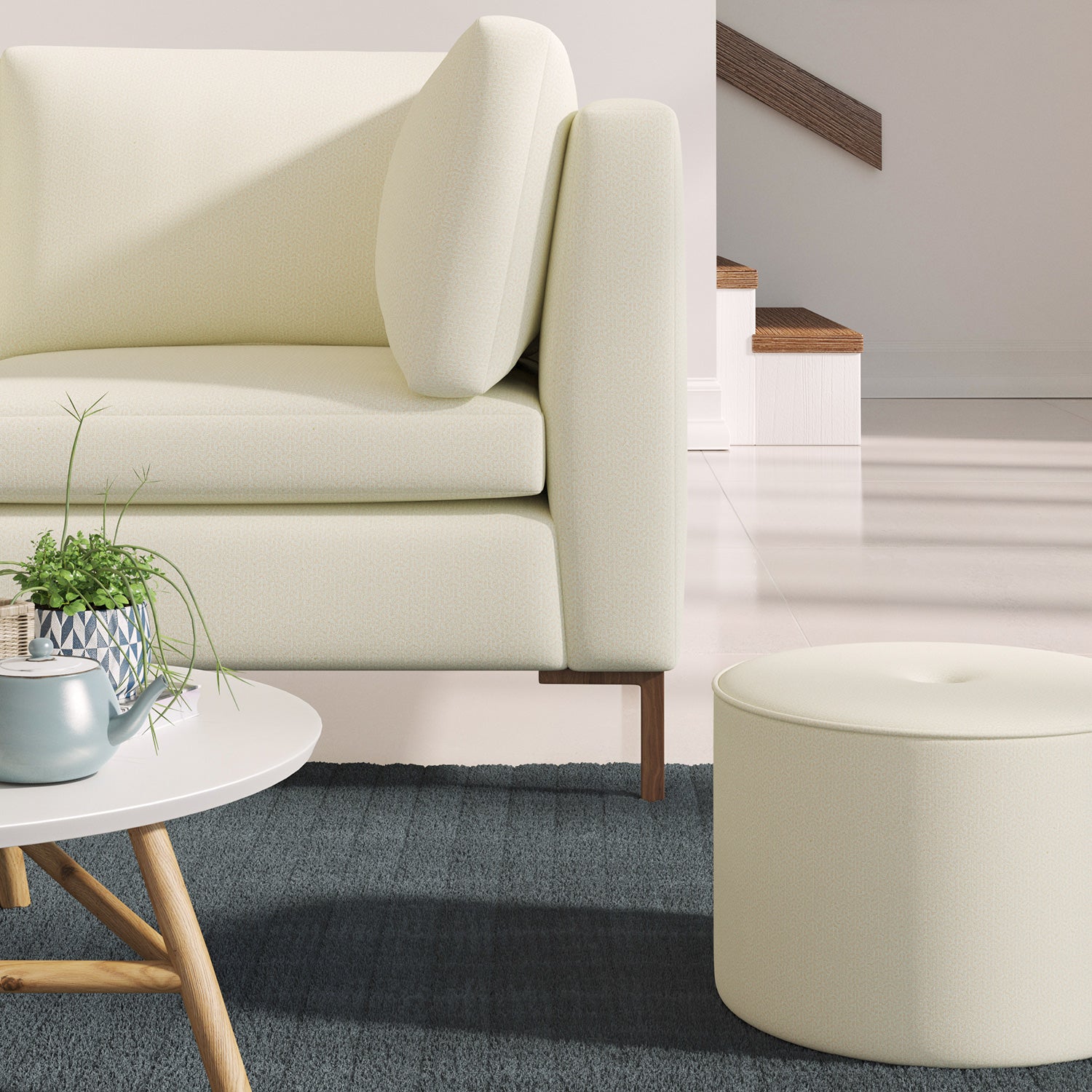 Sofa upholstered in a nude coloured Scandi-style semi-plain upholstery fabric with a stain resistant finish