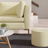 Living room with a contemporary sofa upholstered in a yellow semi-plain Scandi-style upholstery fabric