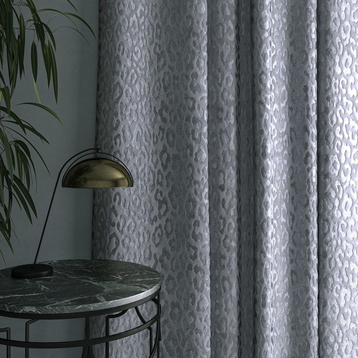 Curtain in luxury blue stain resistant fabric with animal print design 