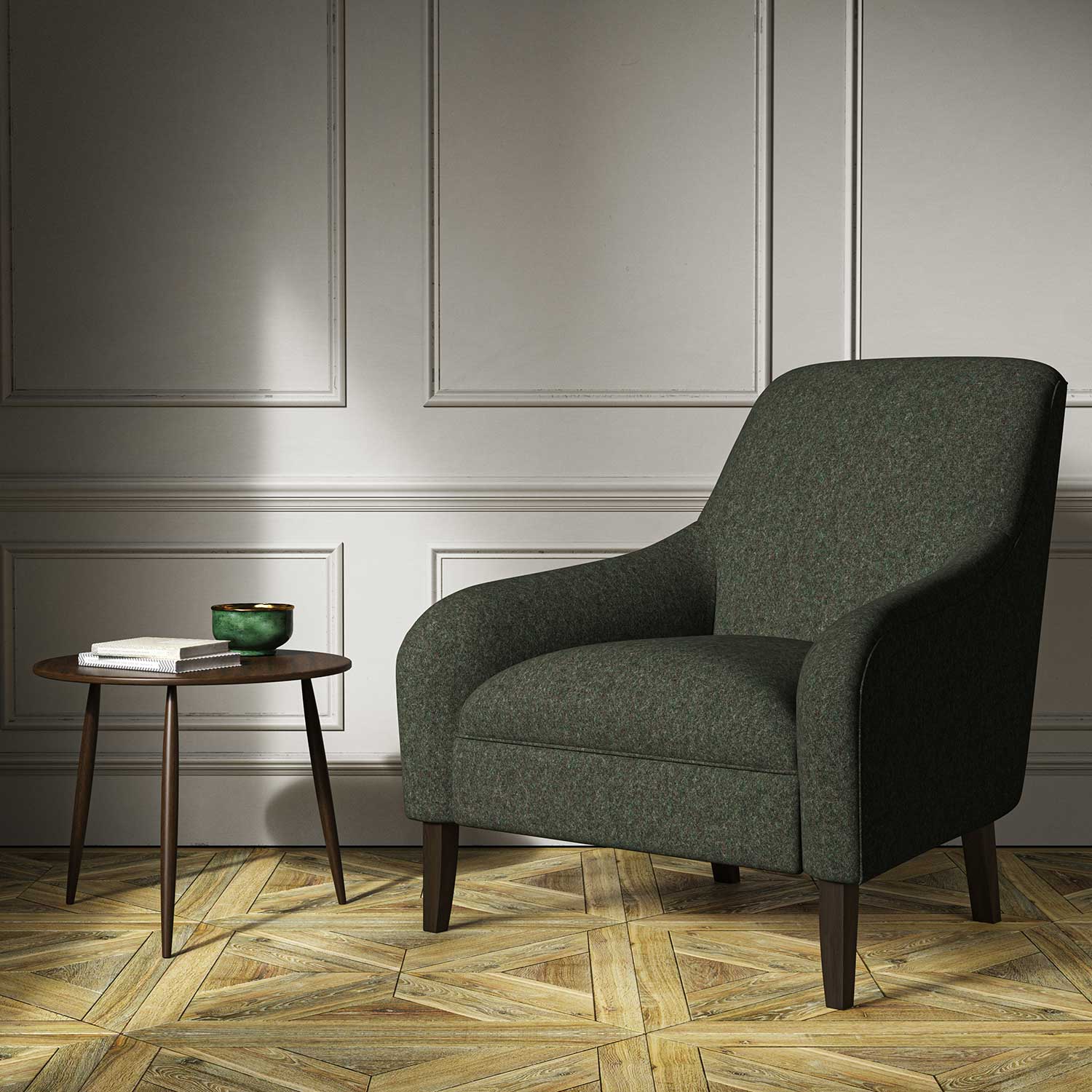 A green woven fabric on an armchair.