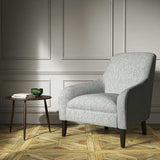 A grey woven fabric on an armchair.