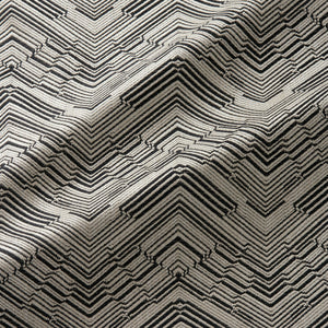 Fabric swatch of a stain resistant herringbone weave design in dark grey colours, suitable for curtains and upholstery