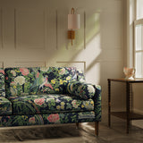 Sofa upholstered in a lively, floral and bird linen fabric