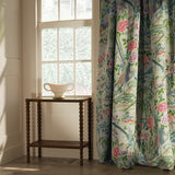 Curtain in a lively, floral and bird linen fabric  Edit alt text