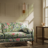 Sofa upholstered in a lively, floral and bird linen fabric