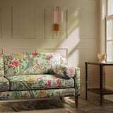Sofa in a lively, floral and bird linen fabric