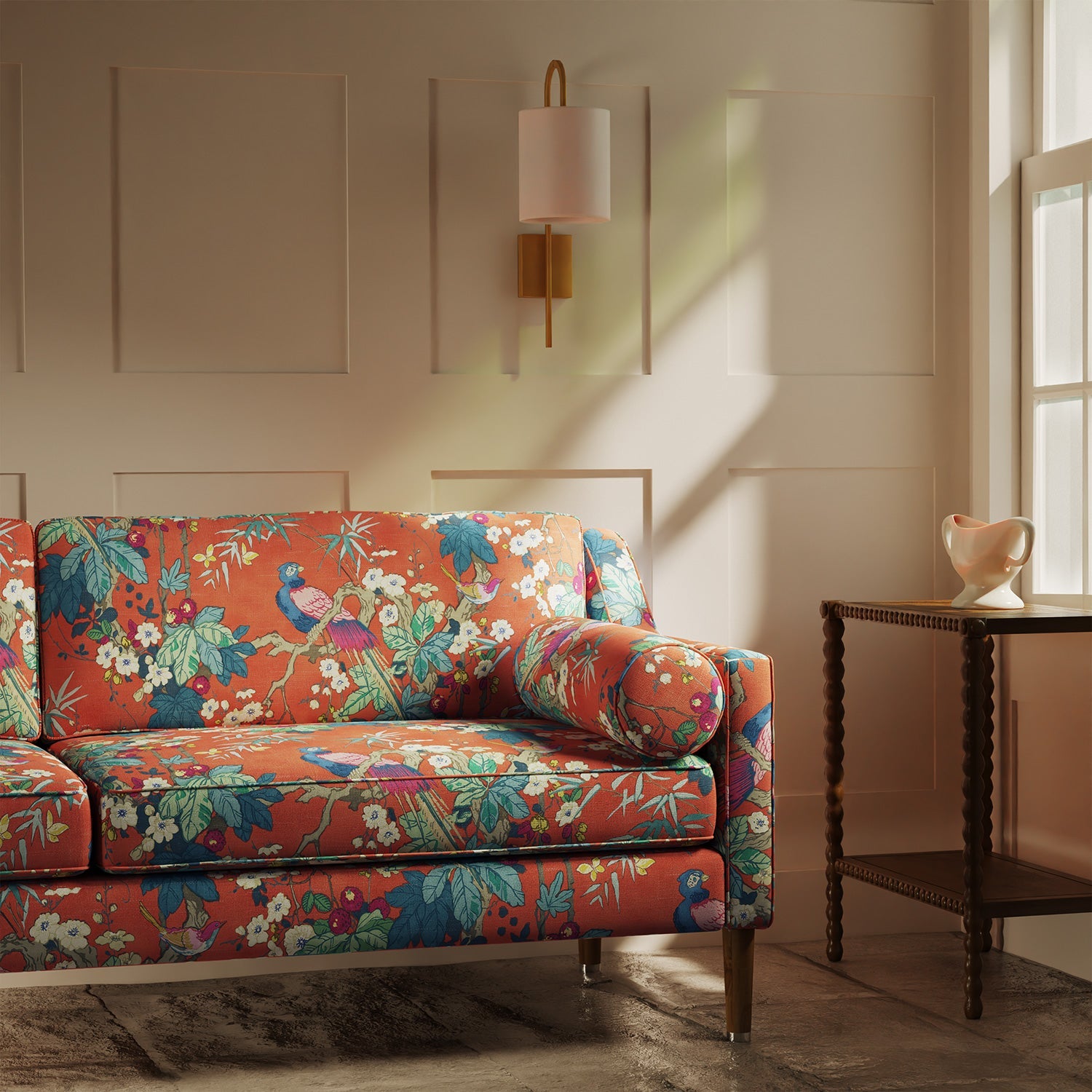 Sofa upholstered in a lively, tropical floral and bird linen fabric