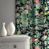 Velvet curtains upholstered in a printed velvet fabric with bamboo and oriental flowers, in multicolours.