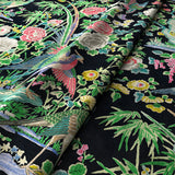 Printed velvet fabric with bamboo and oriental flowers in multicolours, for upholstery and curtain use.