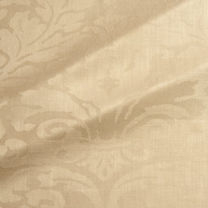 Fabric swatch of a contemporary damask fabric in a light gold colour for upholstery and curtains.