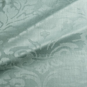 Fabric swatch of a contemporary damask fabric in a light blue colour for upholstery and curtains.
