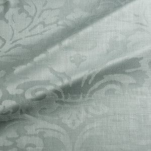 Fabric swatch of a contemporary damask fabric in a light blue colour for upholstery and curtains.