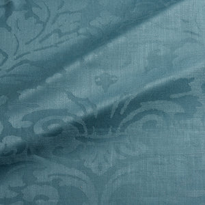 Fabric swatch of a contemporary damask fabric in a blue colour for upholstery and curtains.