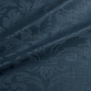Fabric swatch of a contemporary damask fabric in a dark blue colour for upholstery and curtains.