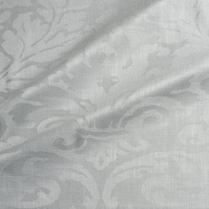 Fabric swatch of a contemporary damask fabric in a light cream colour for upholstery and curtains.