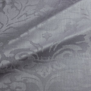Fabric swatch of a contemporary damask fabric in a grey colour for upholstery and curtains.
