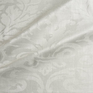Fabric swatch of a contemporary damask fabric in a cream colour for upholstery and curtains.