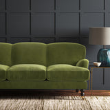 Green eco velvet upholstery fabric on a sofa