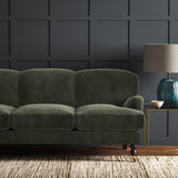Green eco velvet upholstery fabric on a sofa