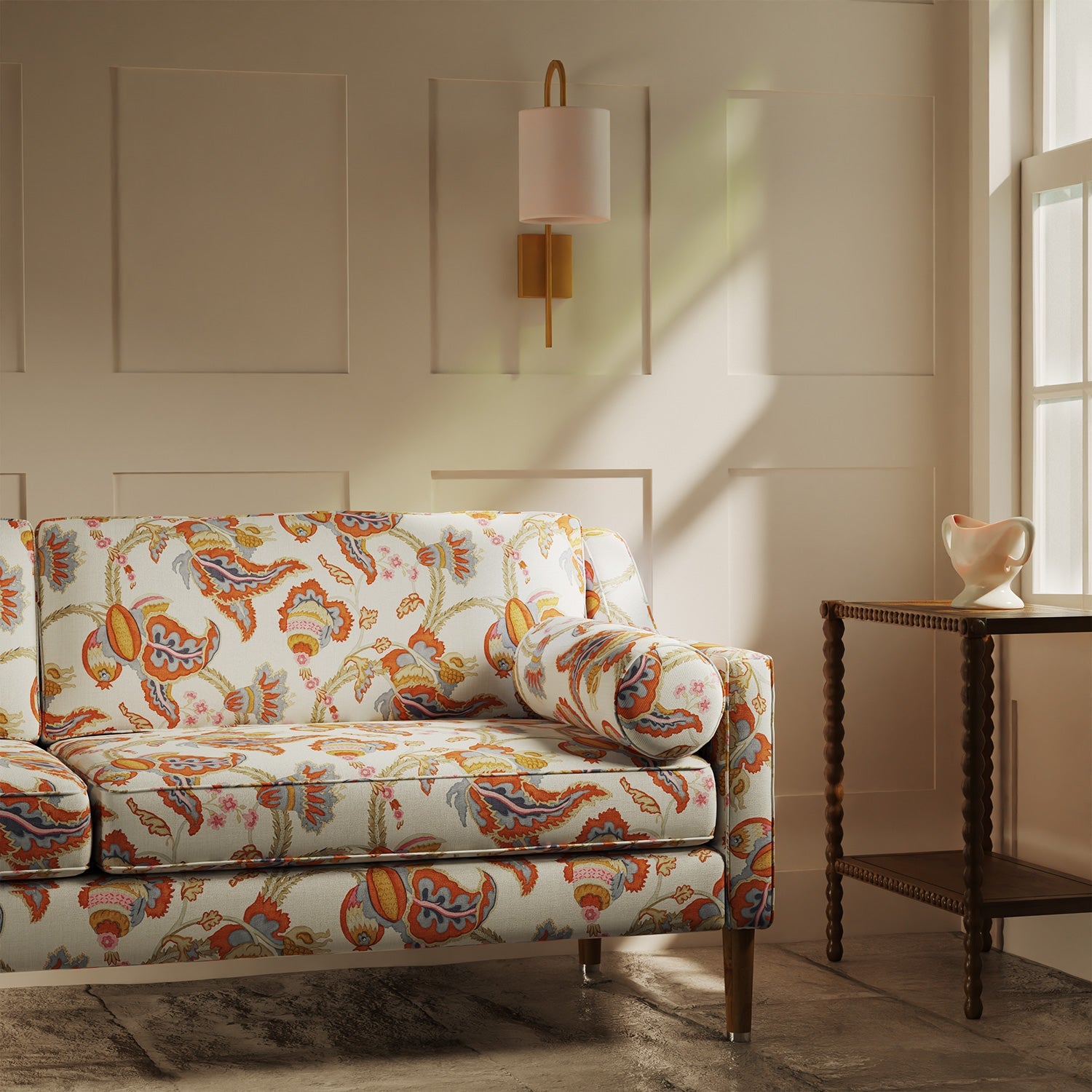 Sofa upholstered in a linen fabric with a floral vine design