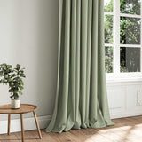 A green woven fabric shown as a curtain.